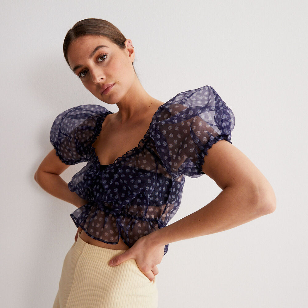 Top con manga abombada con motivos de margaritas - negro negro.